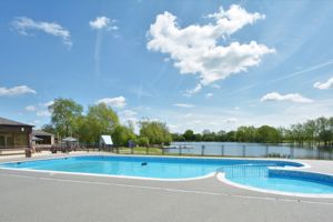Outdoor pool with lake behind- click for photo gallery
